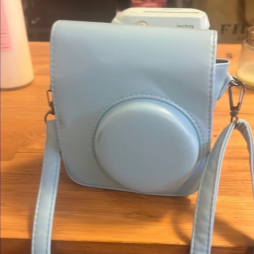 Fujifilm Blue Instax mini 9 film camera with case